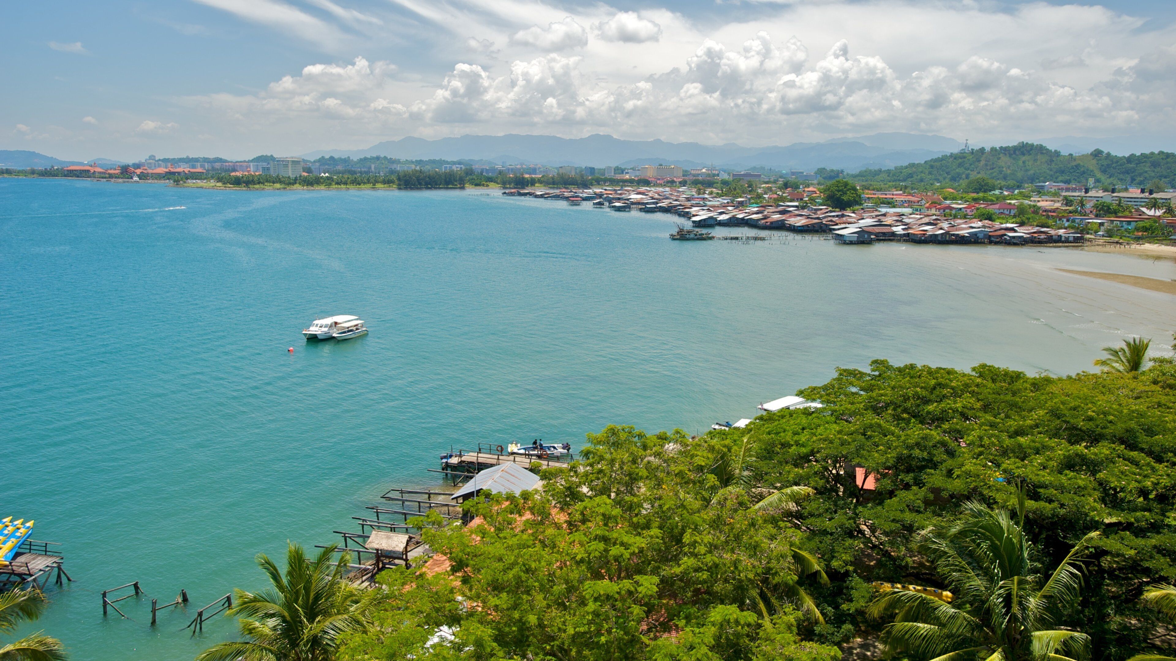 Kota Kinabalu which includes tropical scenes, boating and a bay or harbour
