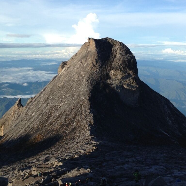 If you into mountain climbing try Gunung Kinabalu. Take the mersilau trail if you want it to be more challenging.  