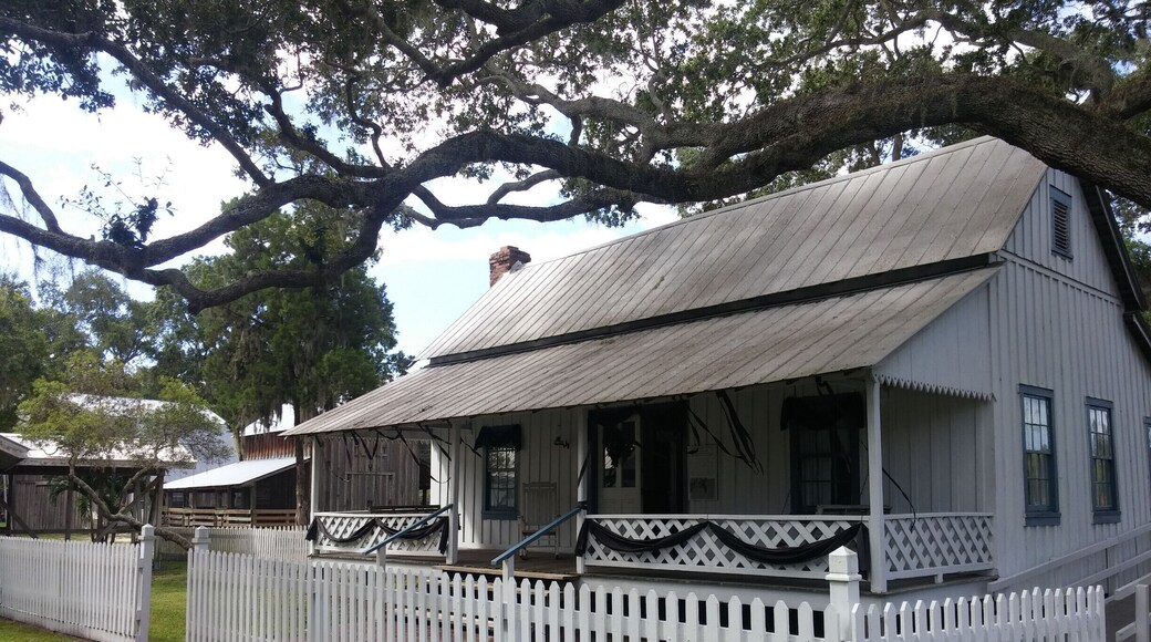 The settler's house was built in 1912 and is furnished with period artifacts. Currently, the house is setup with an exhibit about the customs and cultures of showing the bodies of deceased family members.
The historical park is free and boasts the 1860 Courthouse, the 1887 Church, the One Room Schoolhouse, the Old Settler’s House, the Potter Barn, the Sugar Cane Mill and Smokehouse, the Wiggins Store, a blacksmith shop, a 1913 Baldwin Steam locomotive, the Fogarty Boatworks and a Cowhunter Bunkhouse.