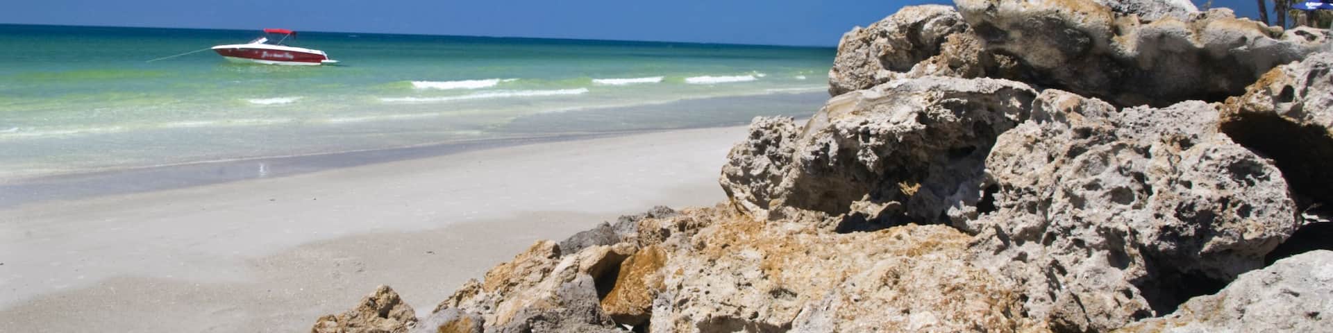 Boulders placed on beach to prevent erosion.