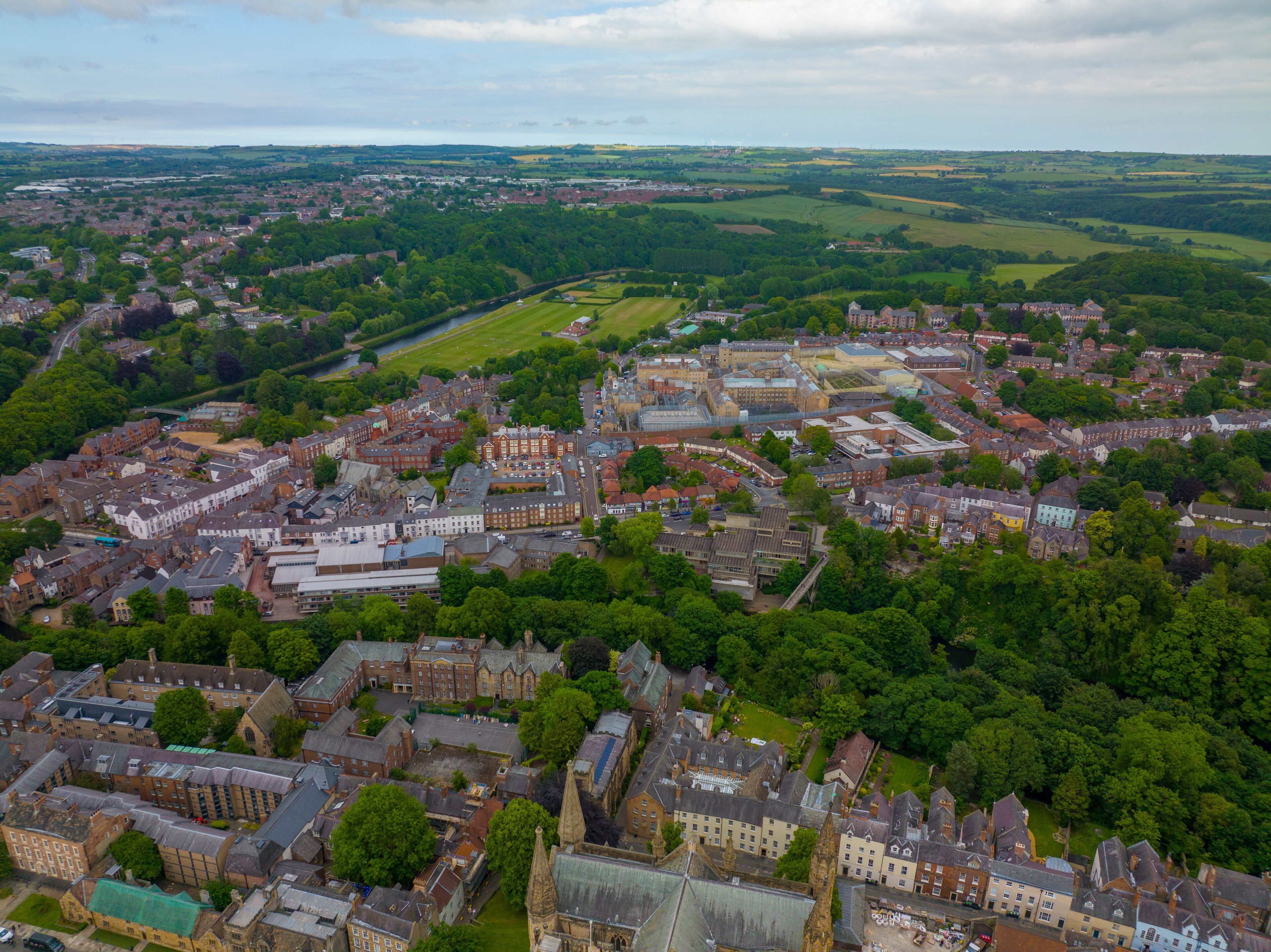 Historic city center of Durham aerial view including Elvet Bridge over River Wear. The Durham Castle and Cathedral is a UNESCO World Heritage Site since 1986. 