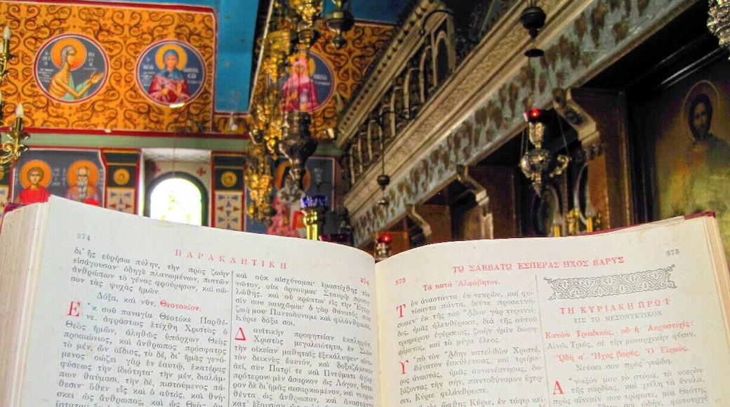 A greek gospel in the Kathara Monastery.
Kathara monastery is situated 566 m. above sea level, 6 klm. away from the village of Anogi.
There are two views concerning the construction of a church and a monastery, both dedicated to Virgin Mary (Panaghia). The first claims that peasants went to the area to burn ''kathara'', i.e. wild grass and thorns, found Virgin Mary's icon and decided to build a church there. The second view related the foundation of the monastery with the Catholic sect of Kathara. Whichever of the two views is true, it is a fact that Virgin Mary's church was built in 1696 and the monastery which was built a few years later was active until the 1980's.
Nowadays no monks live in the monastery which is open only in summer offering hospitality to the visitors. Virgin Mary's icon is believed to have been painted by Loukas, the Evangelist. The church's wooden carved icon screen is also of superb beauty. Until recently another valuable icon, probably painted by El Greco, was kept in the monastery. The icon is depicting Jesus on the way to Calvary. This icon is today kept in Aghios Georgios' church, in Vounaki. Panaghia Kathariotissa who is the island's patron saint celebrates on 8th and 14th September and on Easter Sunday.