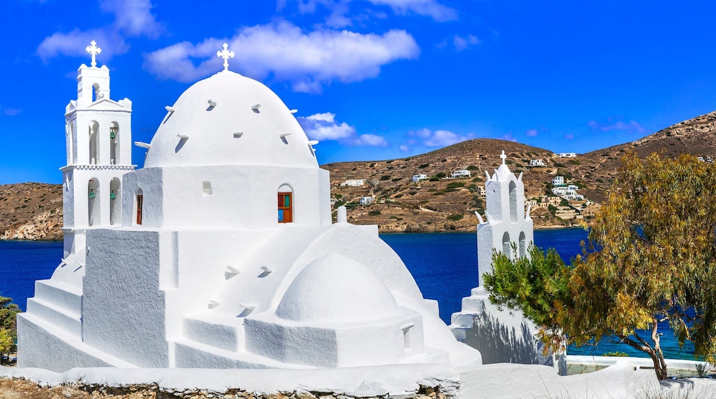 Greece travel. Stunning nature scenery and traditional churches of Cyclades, Ios island. Whitre church near the port