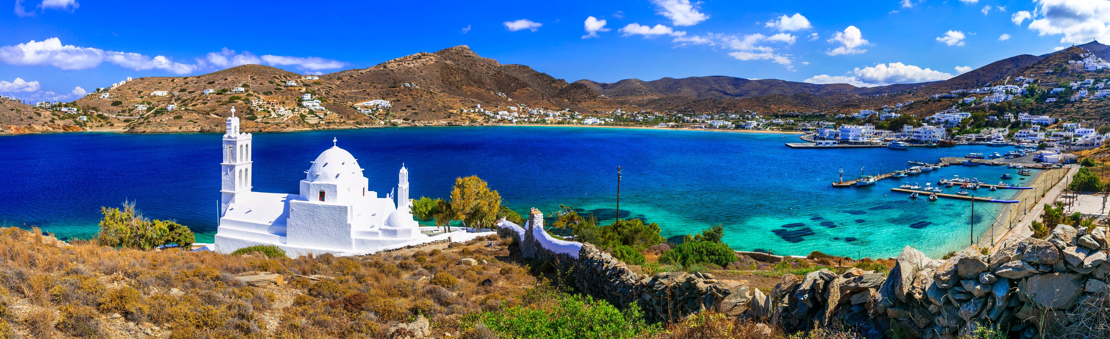 Greece nature scenery. Sea and beaches. Beautiful Ios island, Cyclades. View with little white church near the port