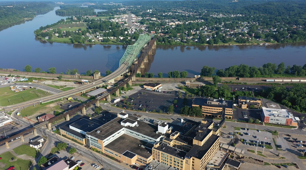 Panoramic aerial view of Parkersburg, West Virginia, featuring the Ohio River, Little Kanawha, and downtown buildings amidst lush Appalachian landscape.