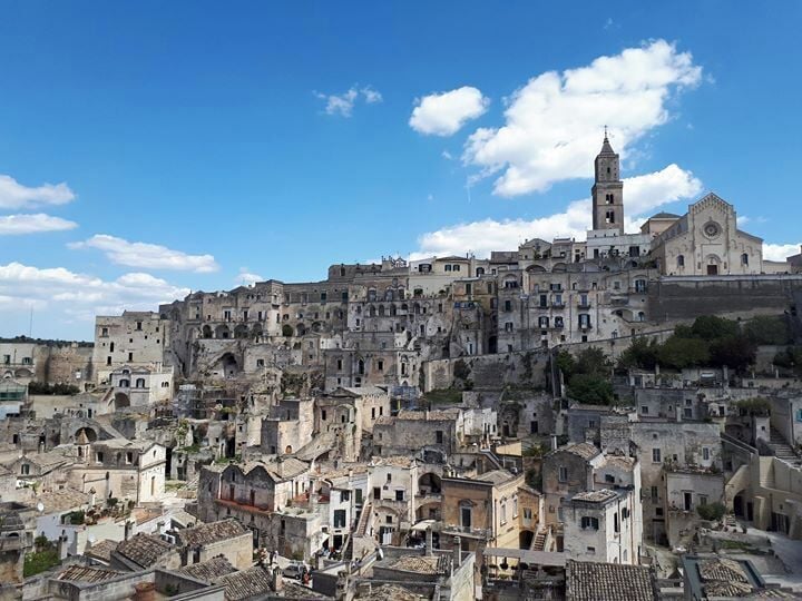 A historic town with a prominent church and a bell tower.