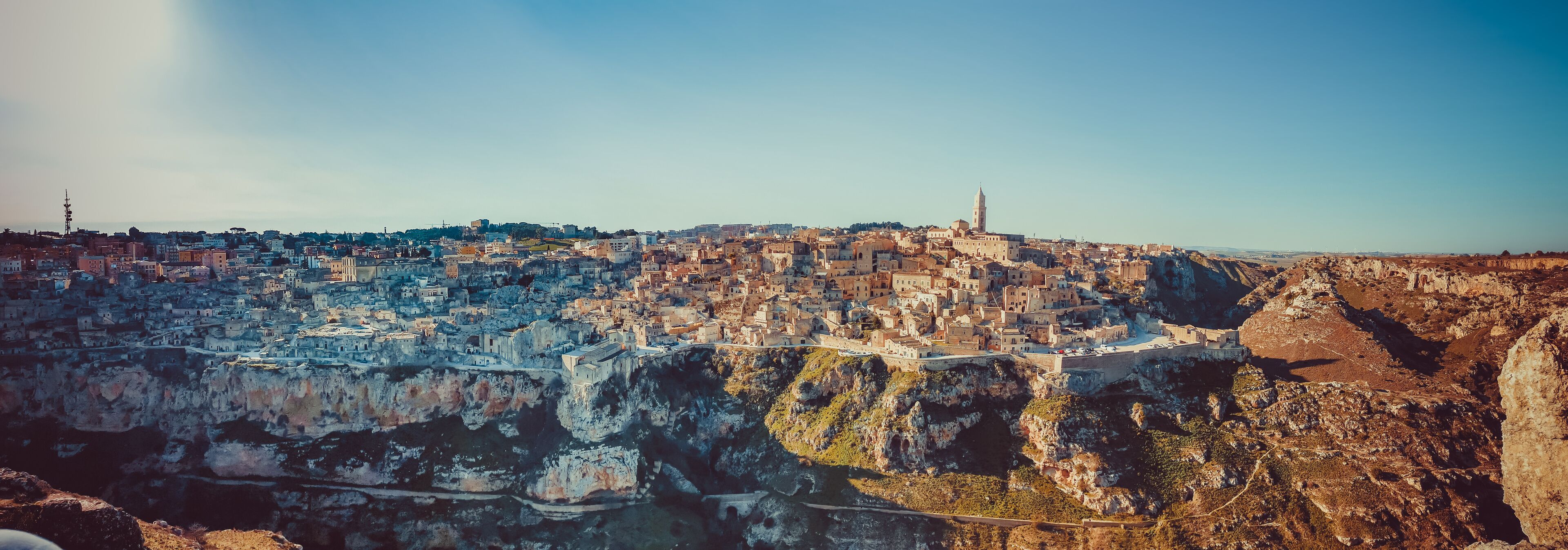 A coastal city with historic architecture perched on cliffs.