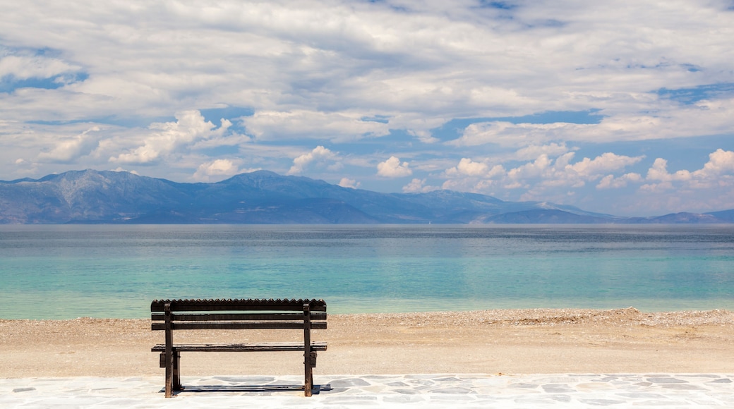 Empty wooden bench by the sea in a cloudy day, gazing the Corinthian gulf, near Xylokastro town, in Peloponnese, Greece.