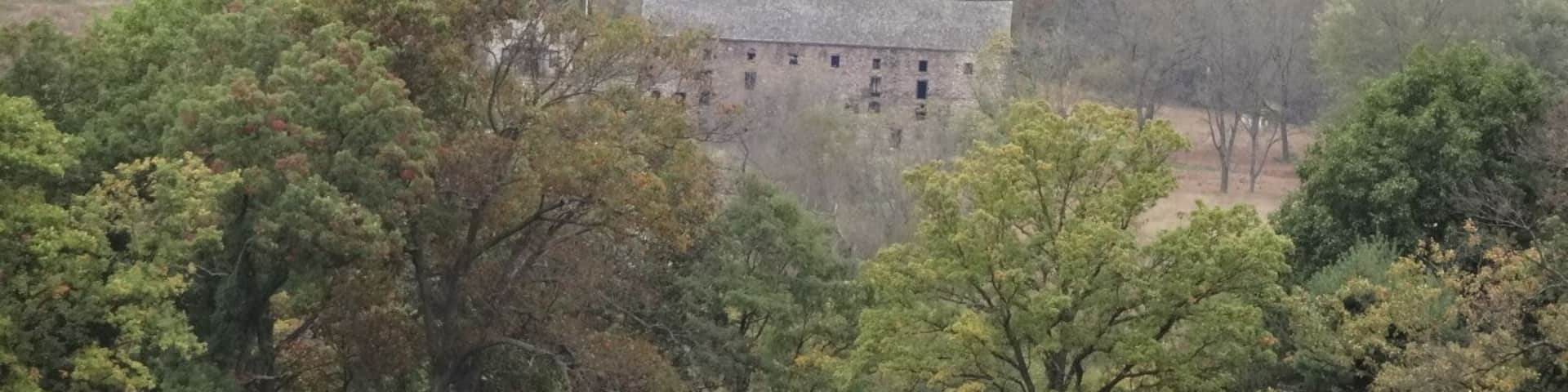 An abandoned building seen off in the distance from one of the main trails/roads through Valley Forge National Historical Park.
