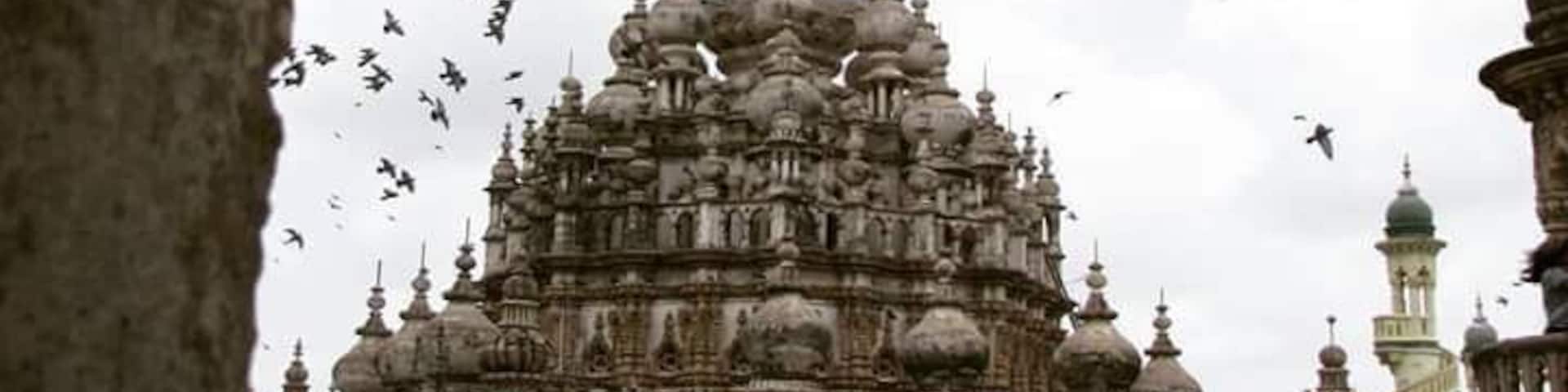 The best of earth can be seen through the tiniest of cracks. 
I took this photo from a tiny window in one of the minars and the birds came flying in at that very instant and added drama to the beautiful Tomb. The sultry skies of the monsoon had their share of play in making it perfect.
#InsideTravellersShoes