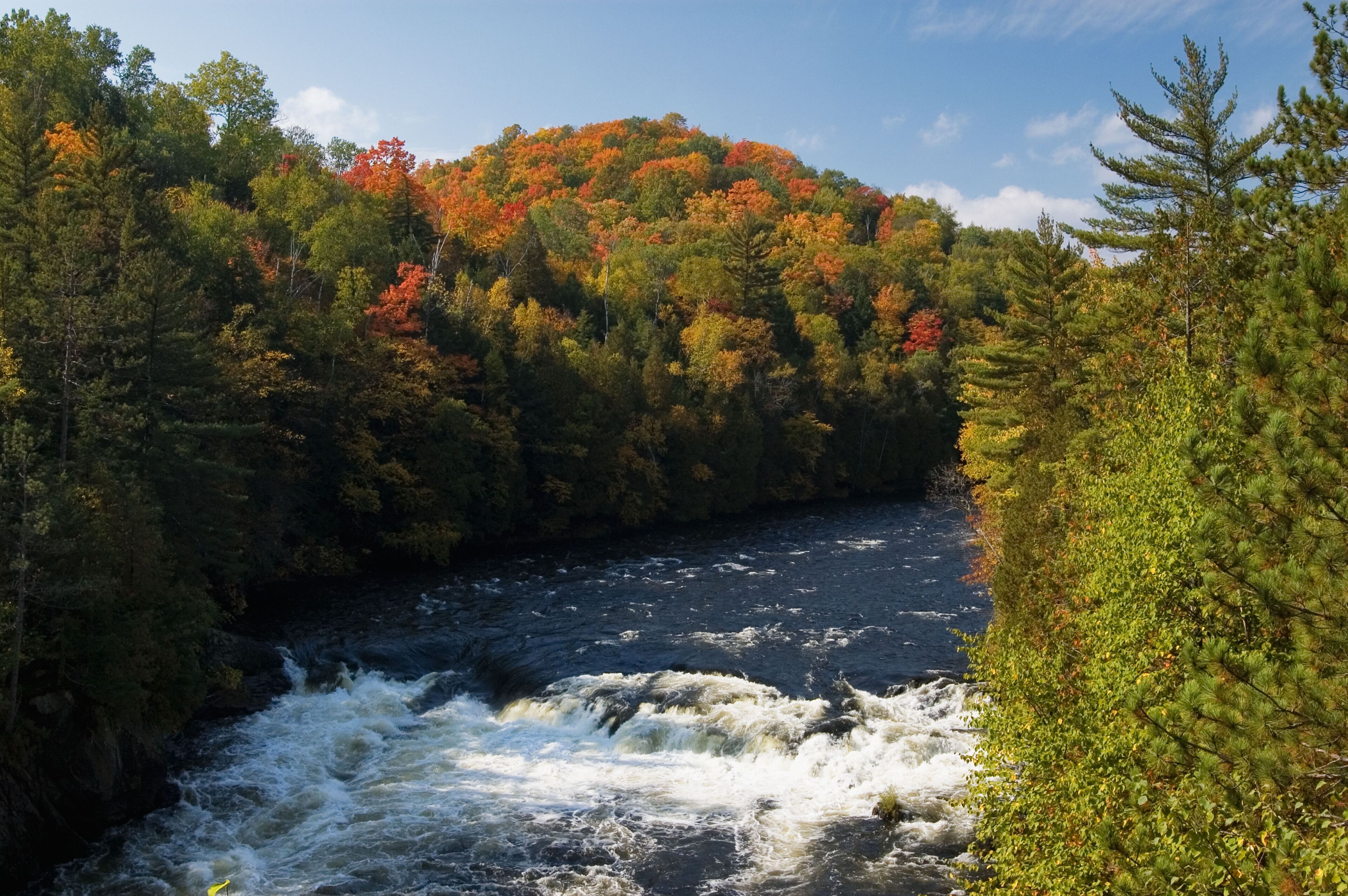 Autumn Color and Rapids on the Menominee River in Piers s Gorge near Norway  Michigan
