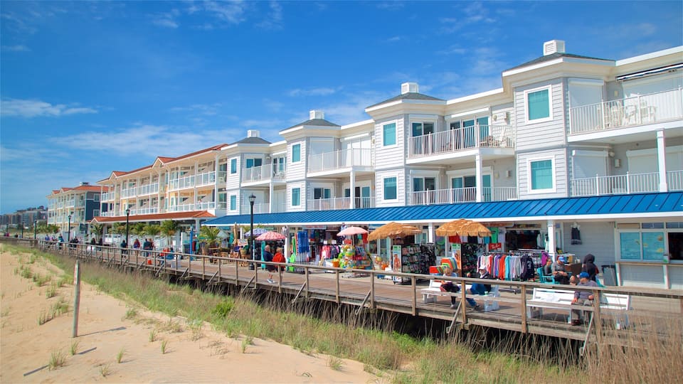 A boardwalk with shops and a beach.