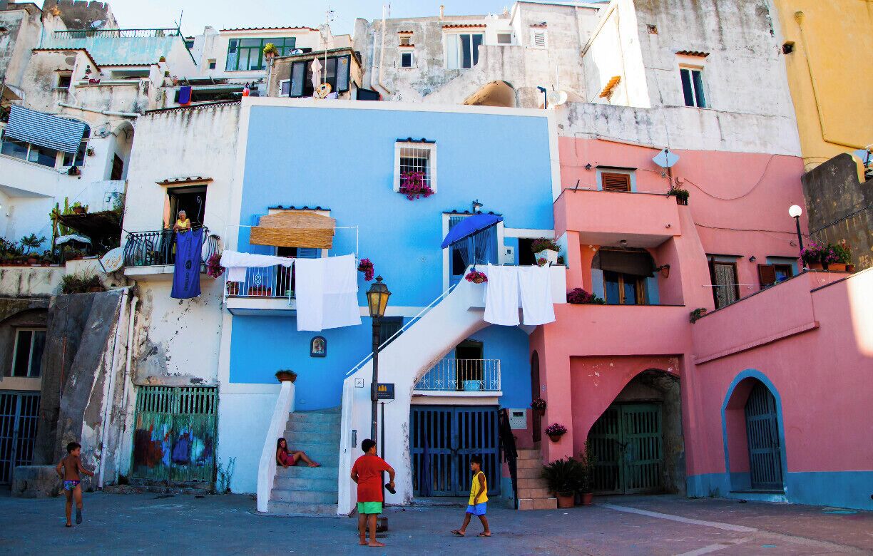 Procida is one of the Flegrean Islands off the coast of Naples in southern Italy. The island is between Cape Miseno and the island of Ischia. With its tiny satellite island of Vivara, it is a comune of the province of Naples, in the region of Campania. The population is about ten thousand. This is a view of Corricella.
