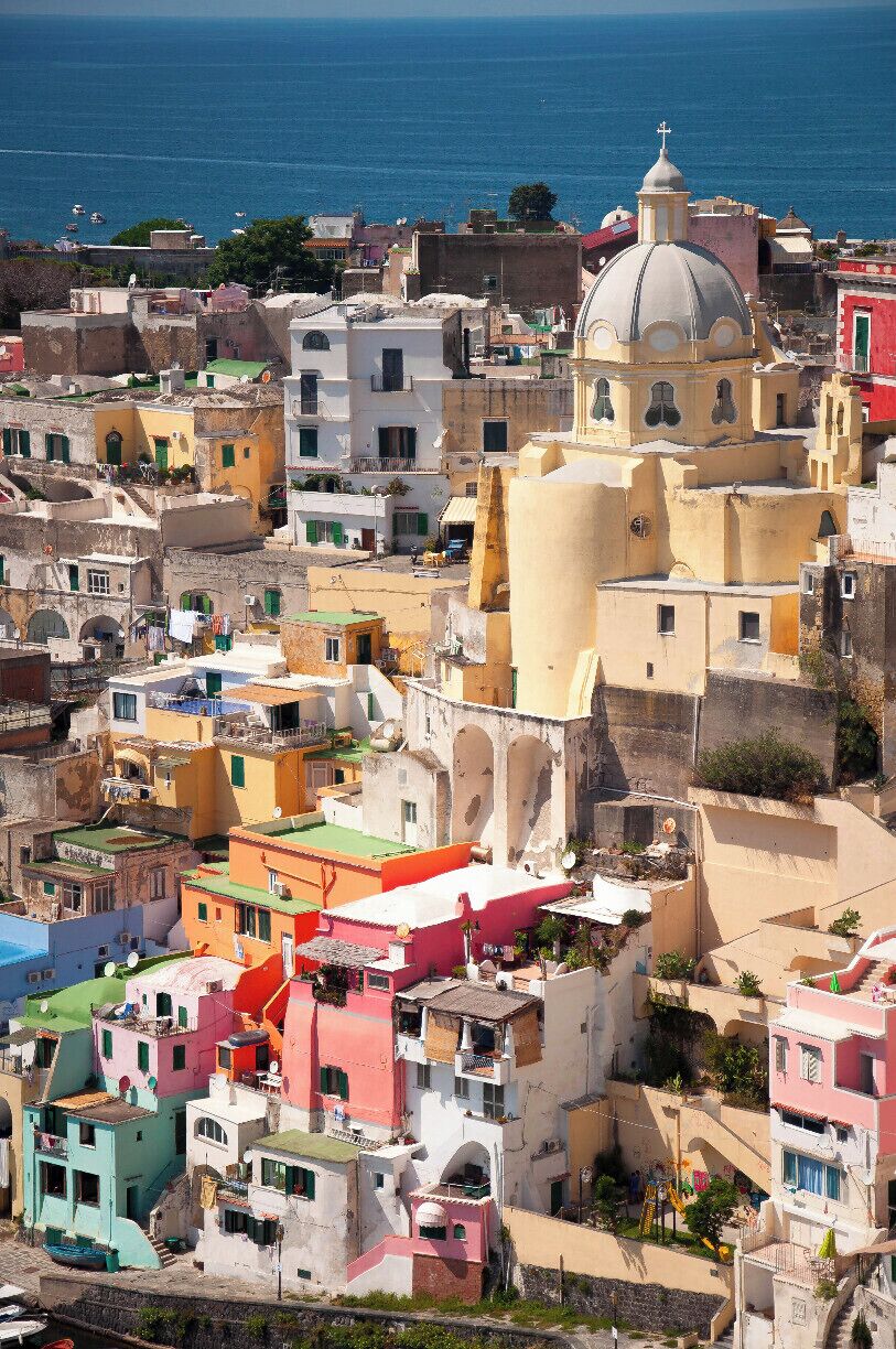 Procida is one of the Flegrean Islands off the coast of Naples in southern Italy. The island is between Cape Miseno and the island of Ischia. With its tiny satellite island of Vivara, it is a comune of the province of Naples, in the region of Campania. The population is about ten thousand. This is a view of Corricella from "Terra Murata".