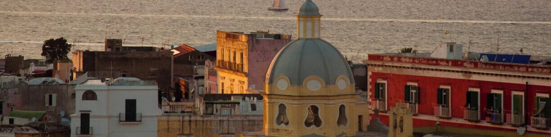 Procida is one of the Flegrean Islands off the coast of Naples in southern Italy. The island is between Cape Miseno and the island of Ischia. With its tiny satellite island of Vivara, it is a comune of the province of Naples, in the region of Campania. It's a view of Corricella from Terra Murata.