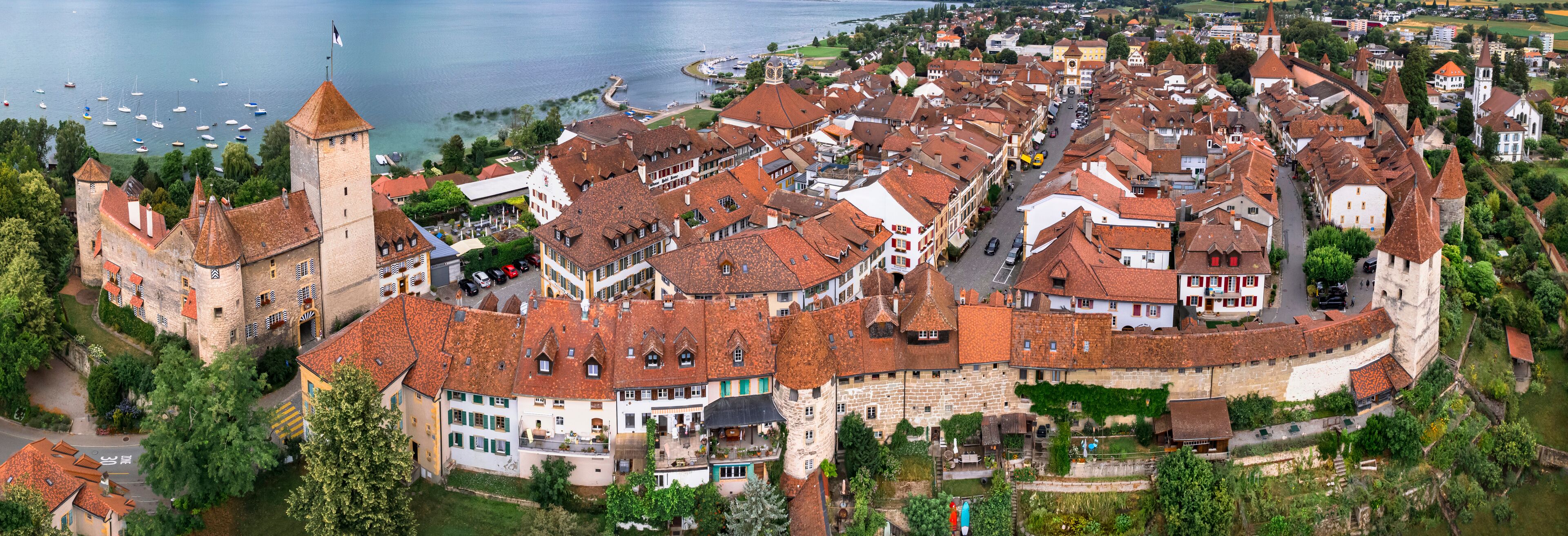 Switzerland travel and landmraks. Charming medieval town Murten (Morat) in scenic lake. aerial drone panoramic view. Idyllic places of Switzerland. canton Fribourg