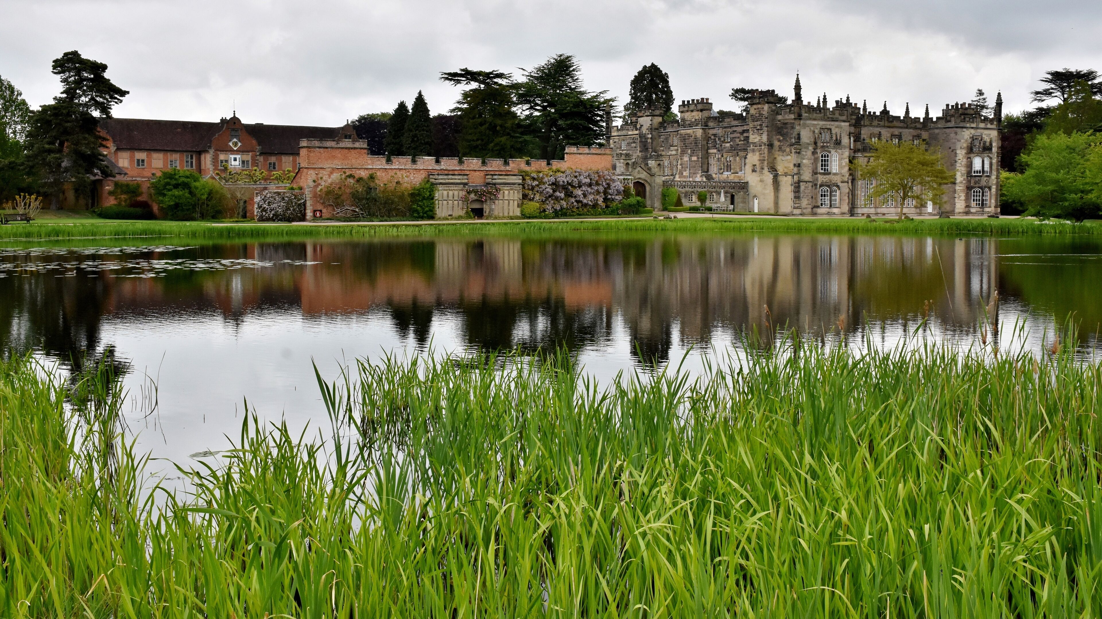 The hall is built on the site of the former Arbury Priory in a mixture of Tudor and 18th-century Gothic Revival architecture, the latter being the work of Sir Roger Newdigate from designs by Henry Keene.