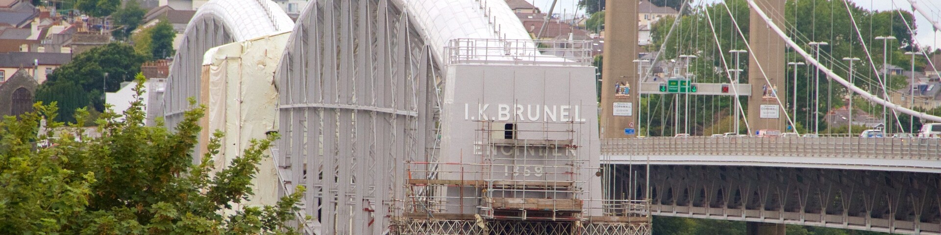 A bridge with a large arch and a building labeled "I.K. BRUNEL" in the background.