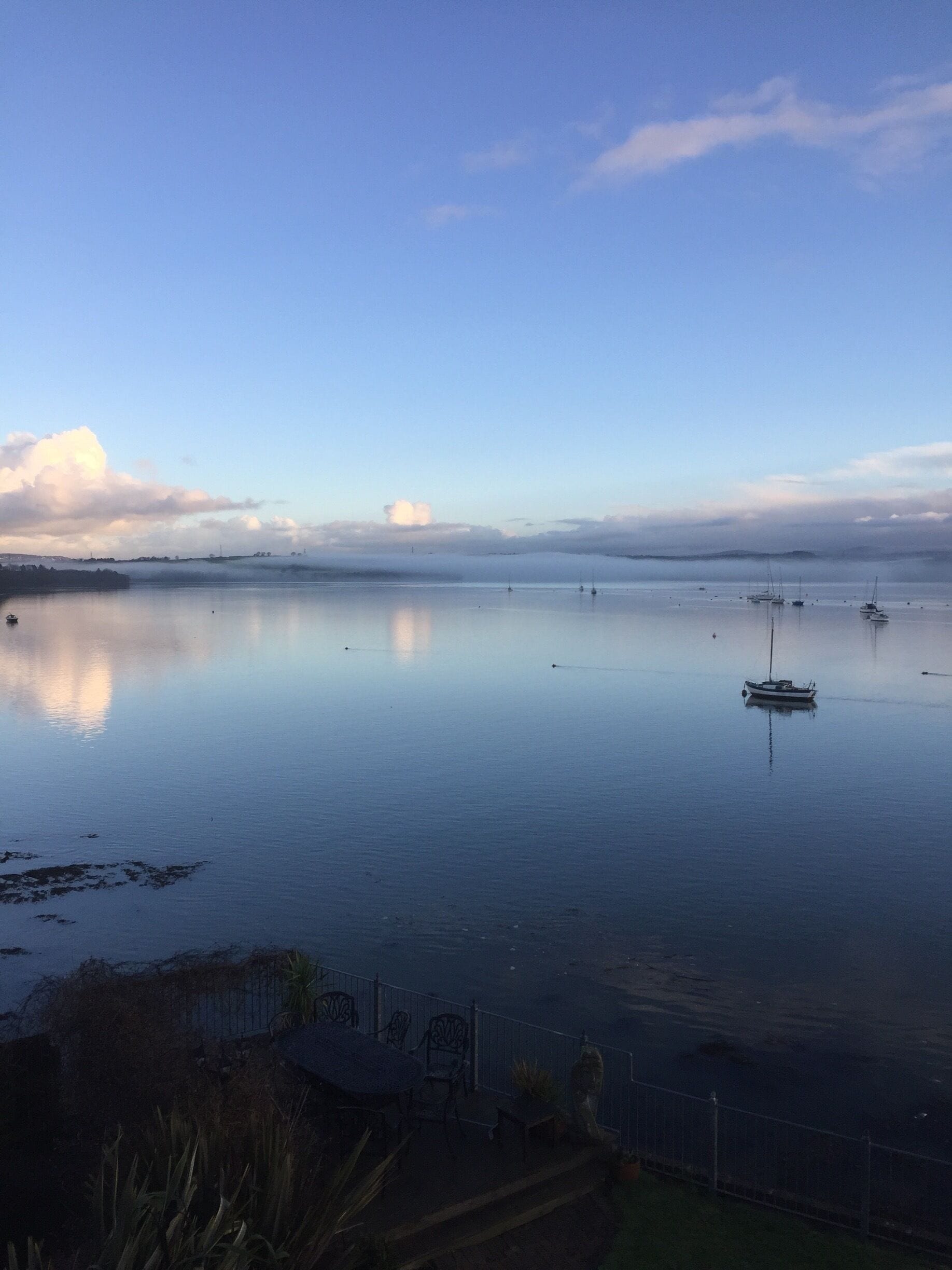 A view on to Saltash estuary in the breaking sun.