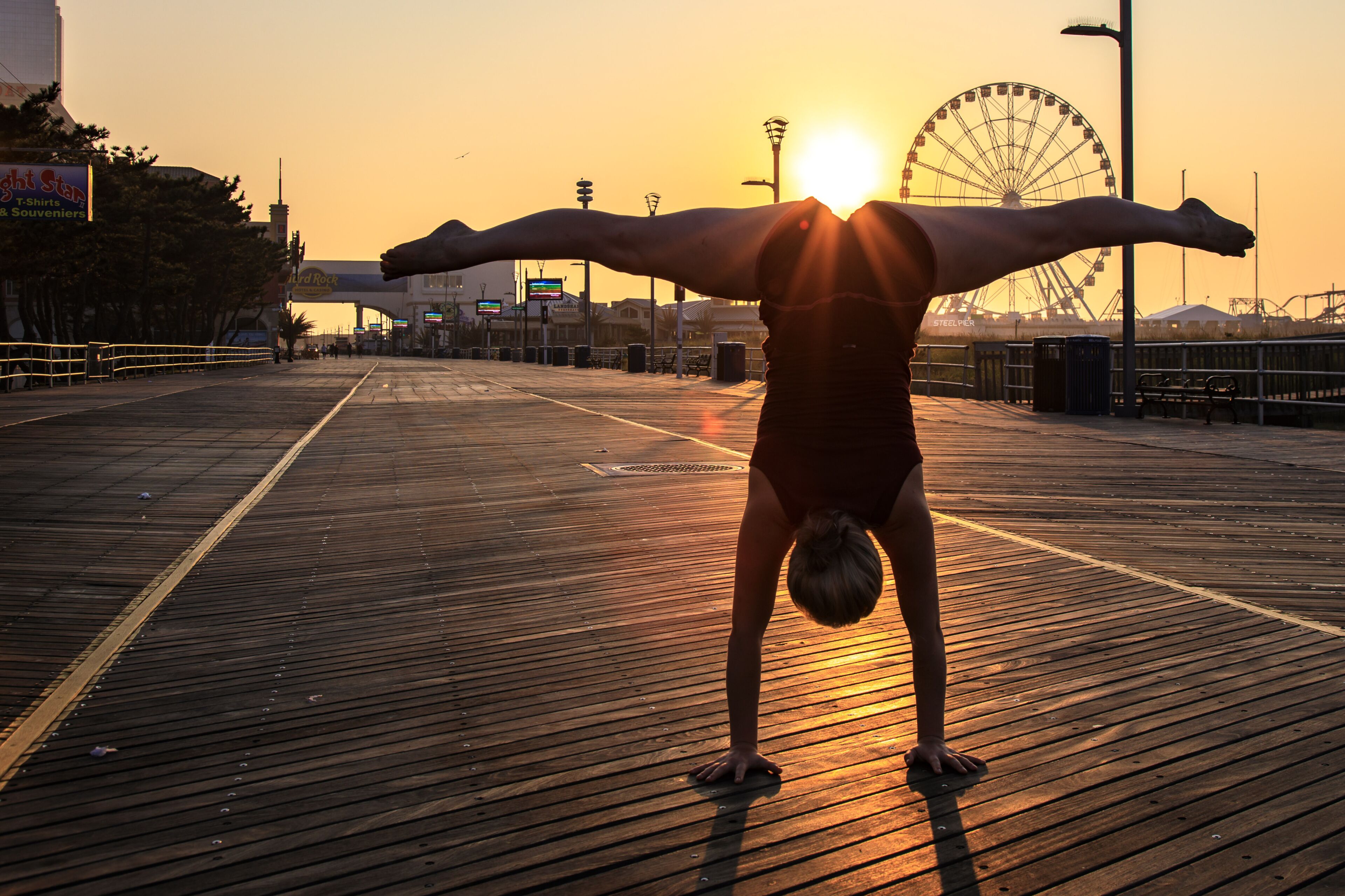 Handstands on the boardwalk by Atlantic City ferris wheel