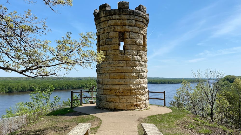 The Julien Dubuque Monument atop a limestone bluff over Mississippi River at the Mines of Spain in Dubuque, Iowa. Julien Dubuque, a Canadian, founded Dubuque as a lead mine in the 1700s.