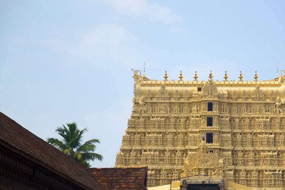 A large, ornate temple with intricate carvings and multiple spires.