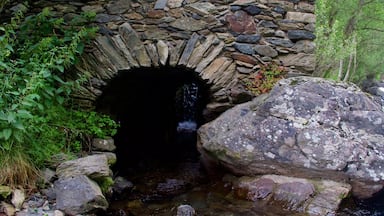 La Cortinada which includes a river or creek and caves