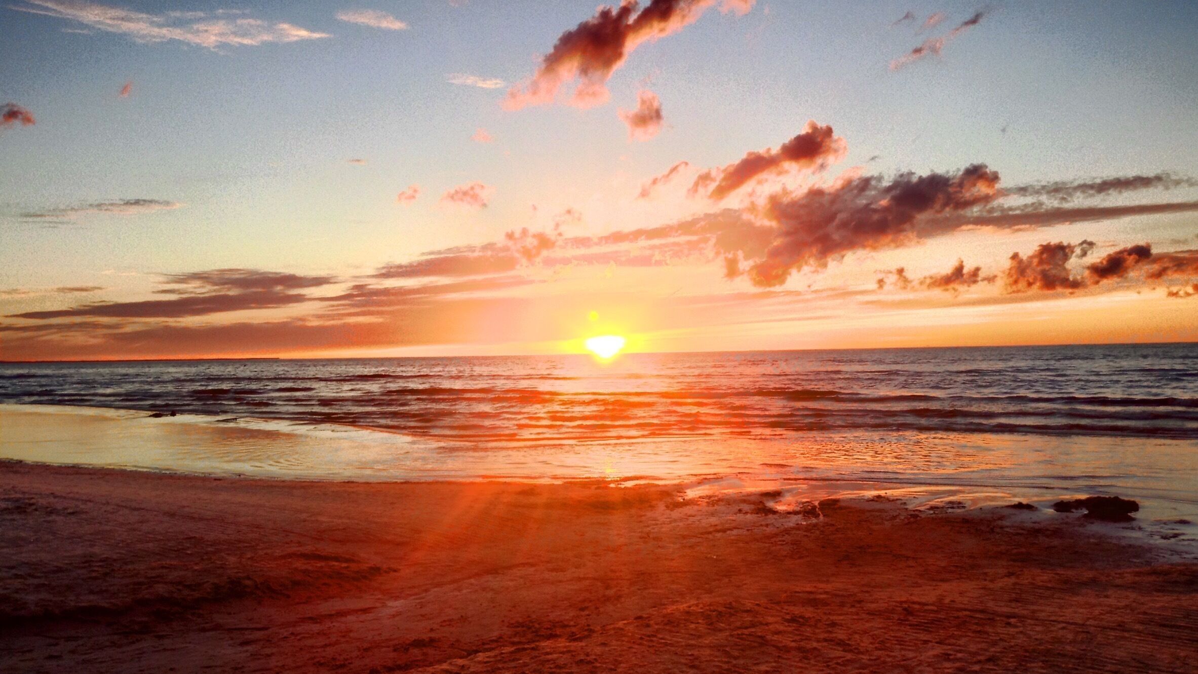 Sunset at the beach in Jūrmala, Latvia. Take the train from Riga, which takes around 30 minutes.

It's fairly touristy, so the surrounding bars and restaurants are fairly touristy, however it's still an excellent day trip from Riga.