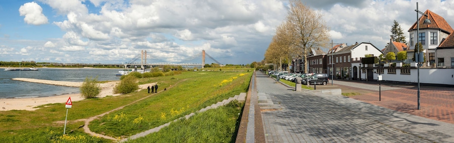 Panoramic view on the riverfront of Zaltbommel, Gelderland, with in the background the famous Martinus Nijhoff suspension bridge crossing the river Waal.