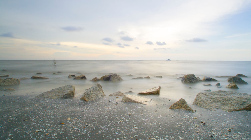 Scenery of sunset captured at Pantai Remis, Selangor, Malaysia. The motion of cloud and water is due to long exposure effect. Low light
