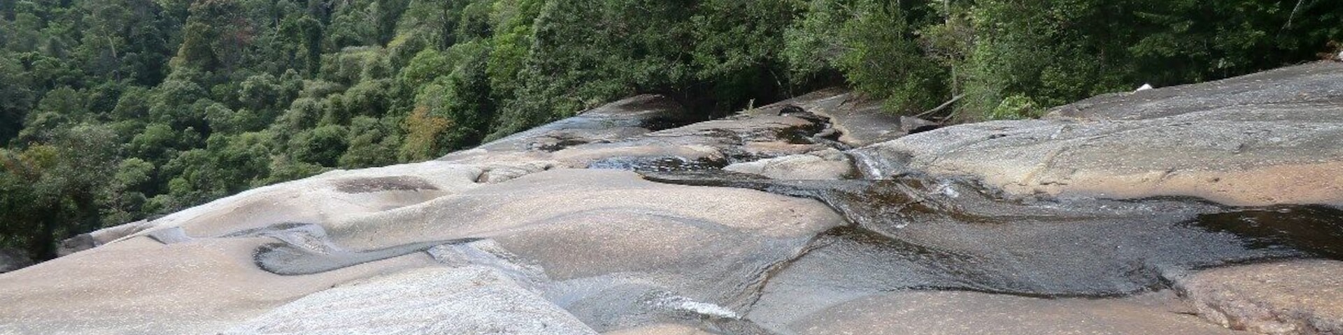 Telaga Tujuh or Seven Wells. We rented a scooter en we took it Island hopping. The seven wells is a great stop.