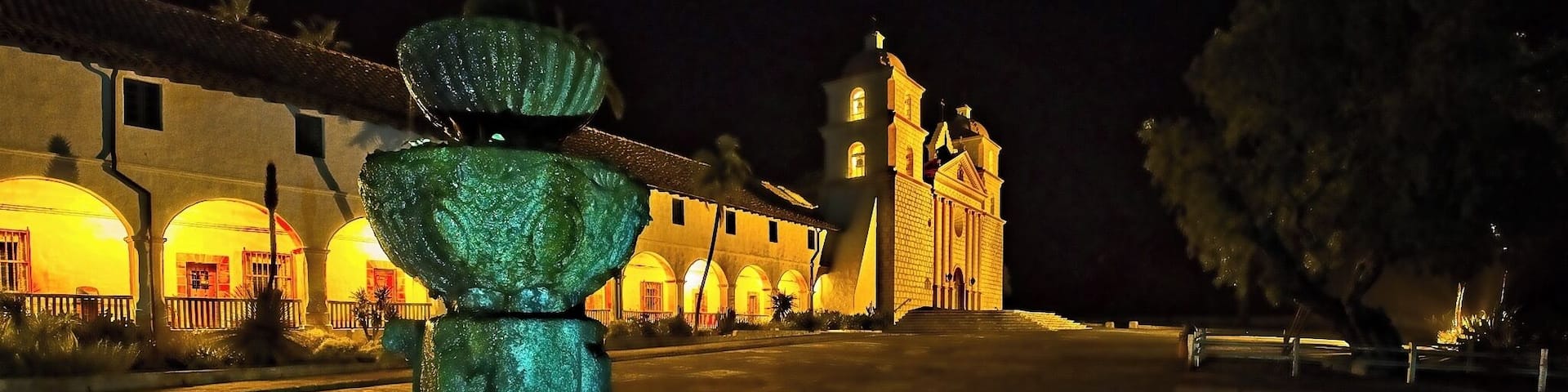 In the foreground is the fountain of the Old Mission Santa Barbara. This fountain was built in 1806 by the local Chumash Indians under the guidance of the Franciscans and is older than much of the main building which, most recently, had the two towers rebuilt in 1927 following earthquake damage.
