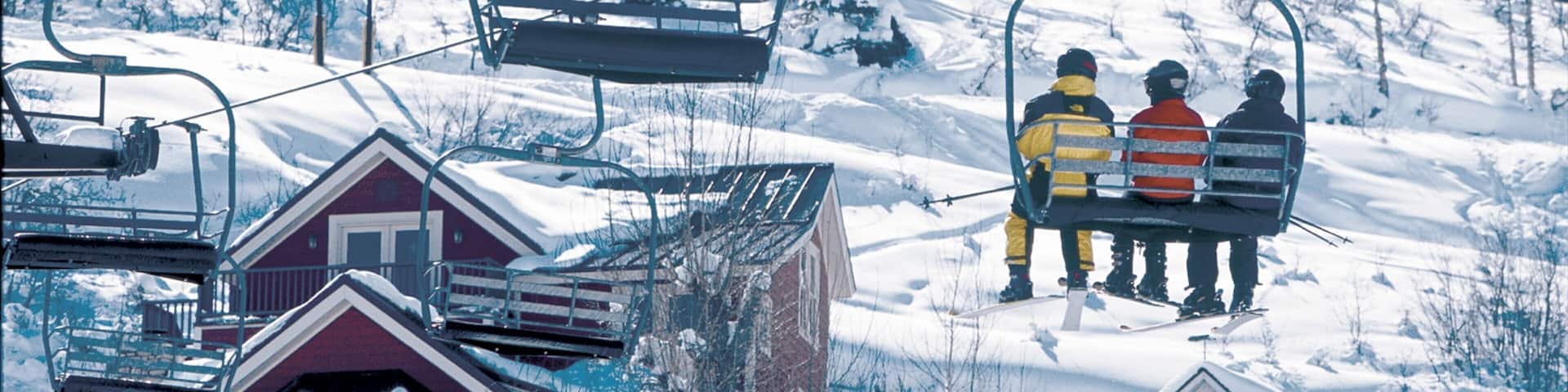 Park City showing a gondola and snow