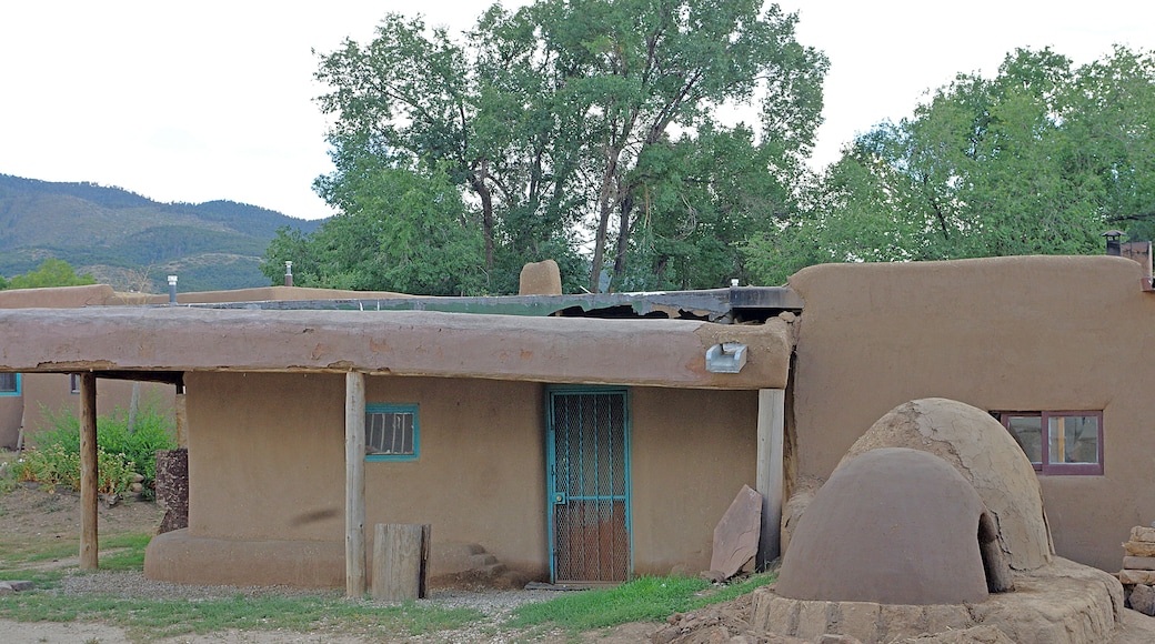 Taos Pueblo (or Pueblo de Taos) is an ancient Pueblo belonging to a Taos-speaking (Tiwa)Native American tribe of Puebloan people,. It lies about 1 mile (1.6 km) north of the modern city of Toas, New Mexico. The pueblos are considered to be one of the oldest continuously inhabited communities in the United States. This has been designated a UNESCO World Heritage Site.