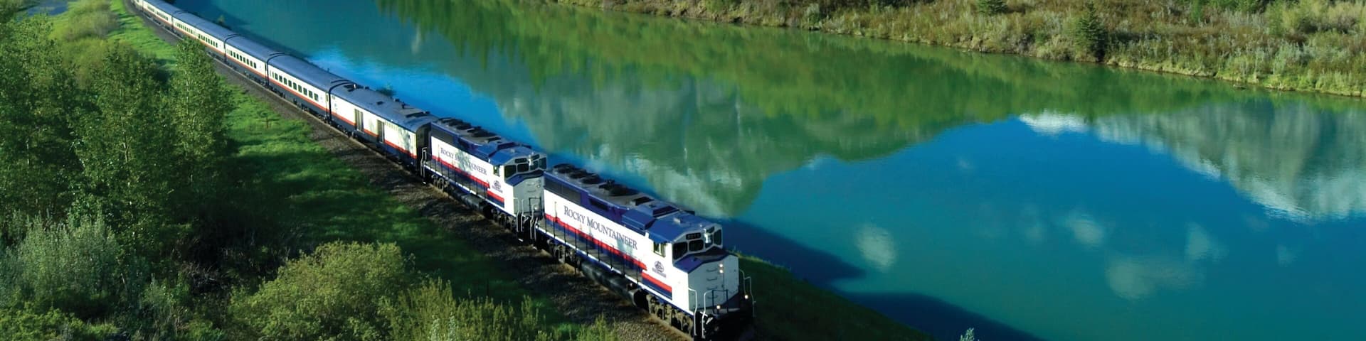 Banff National Park showing a lake or waterhole, landscape views and railway items