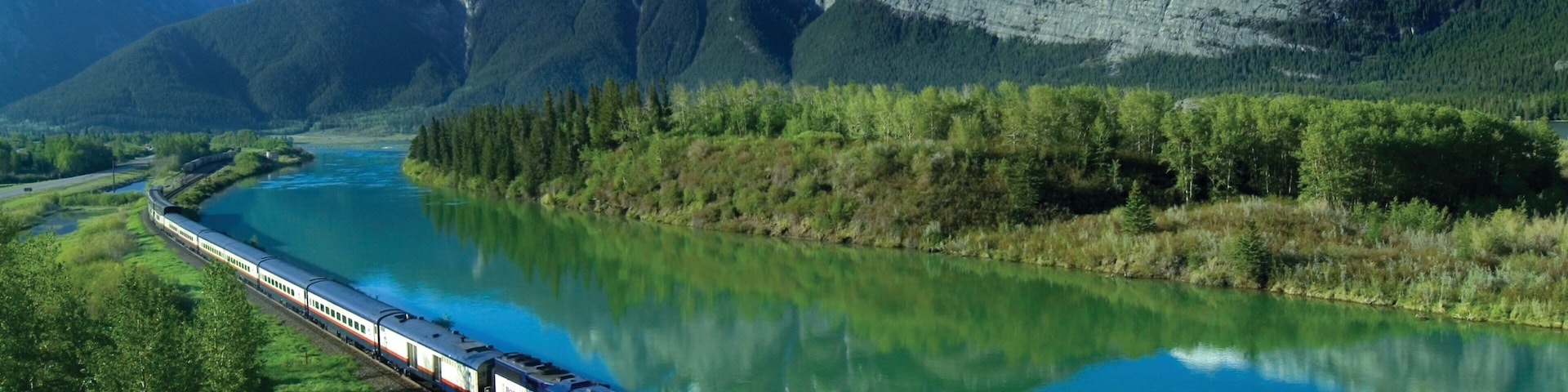 Banff National Park showing a lake or waterhole, landscape views and railway items