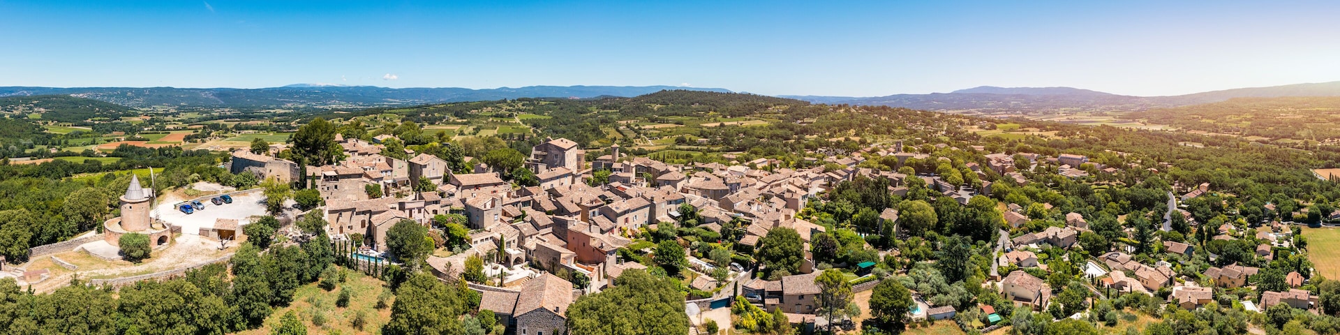 View of Goult, a small typical town in Provence, France. Discover the stunning hilltop village of Goult in Provence on a sunny day. Ancient hilltop village of Goult, Provence, France.