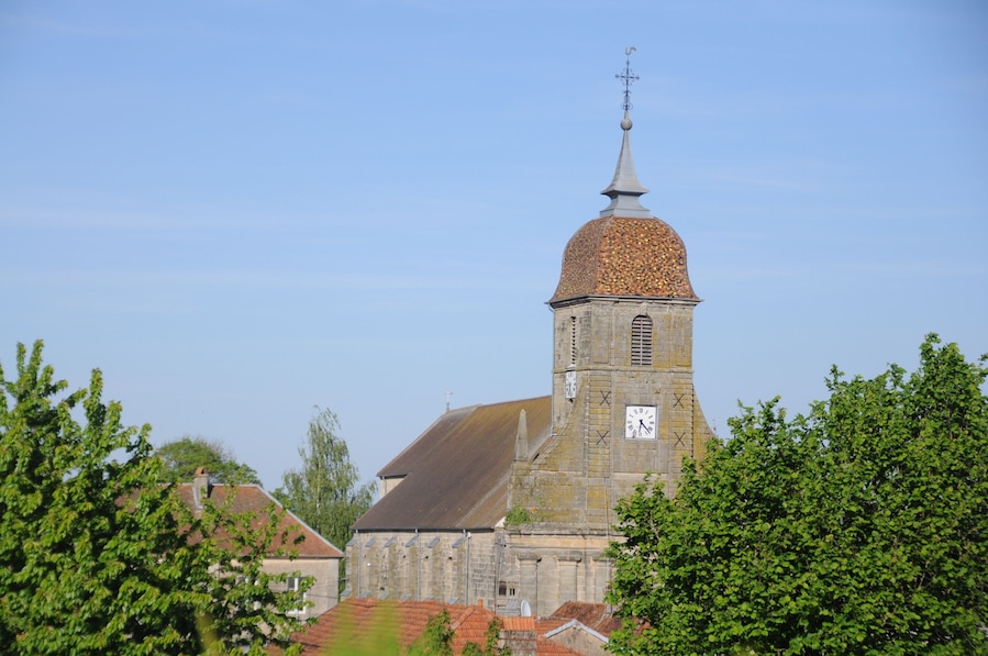A historic church with a tall bell tower and a clock.