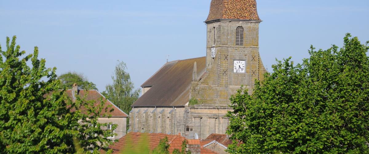 A historic church with a tall bell tower and a clock.