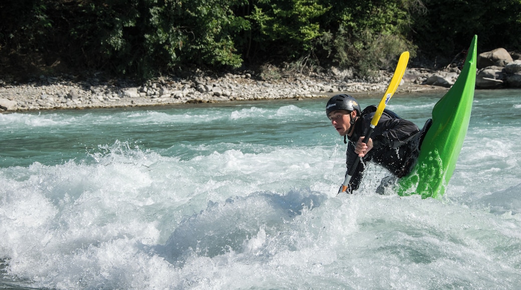 Kayaker playboating at the wave called la Clapière, at Embrun on the Durance river (France).