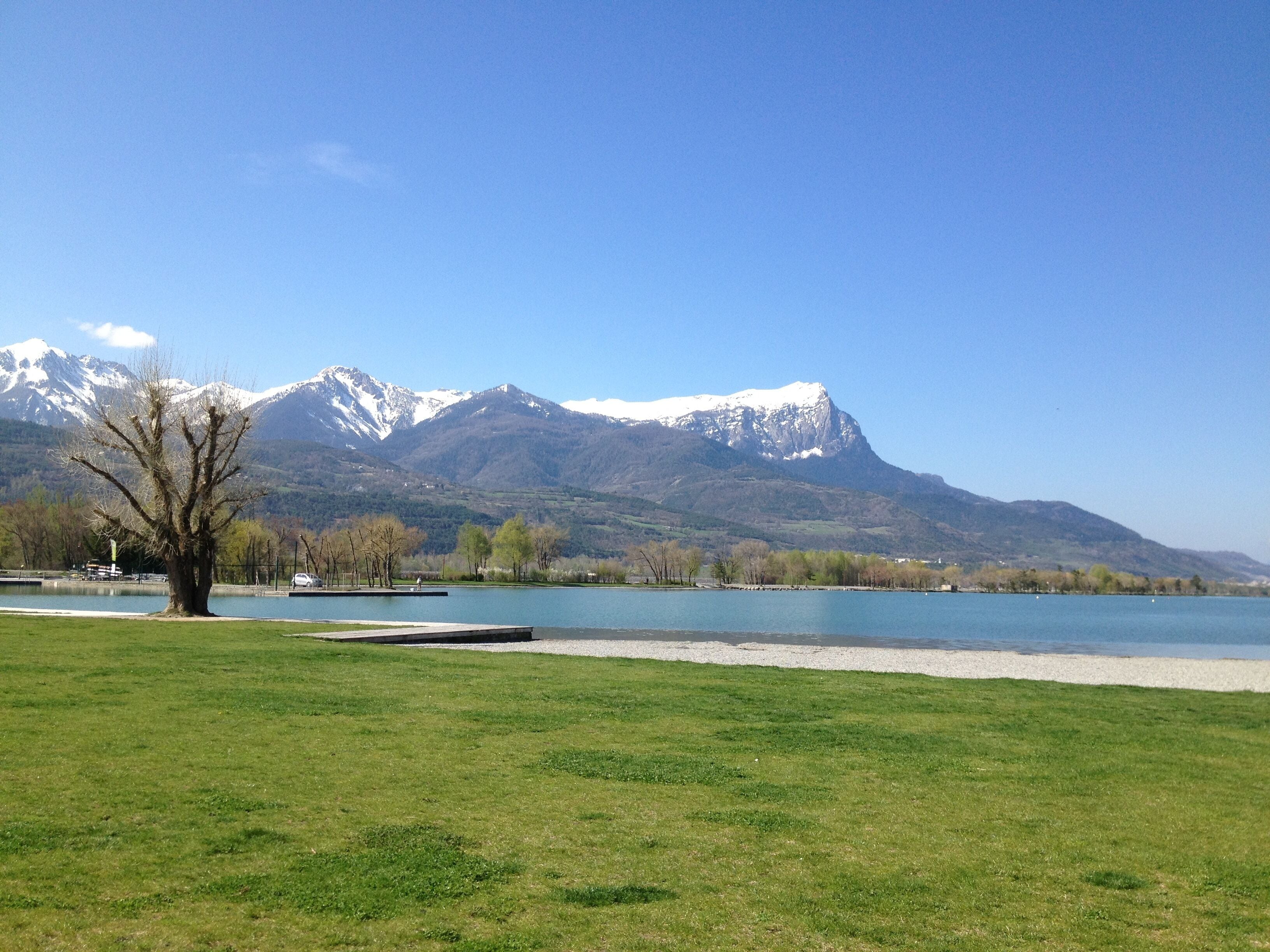A lake with mountains in the background.