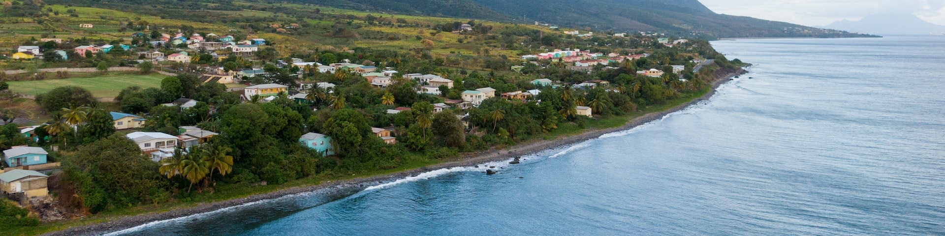 St. Kitts which includes general coastal views, landscape views and a coastal town