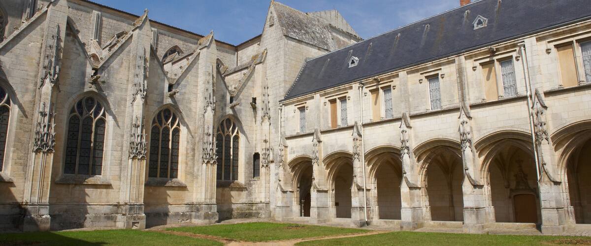 A historic building with Gothic architecture, featuring pointed arches and detailed stonework.