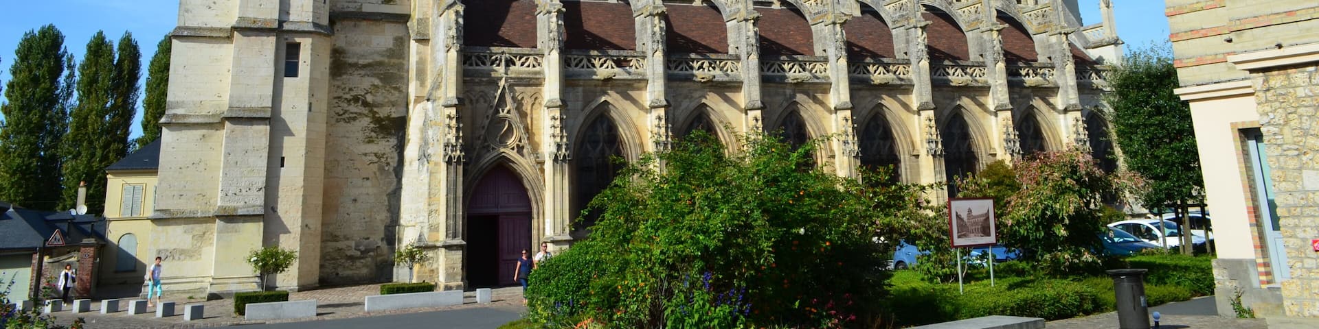 A historic church with a prominent bell tower and arched windows.