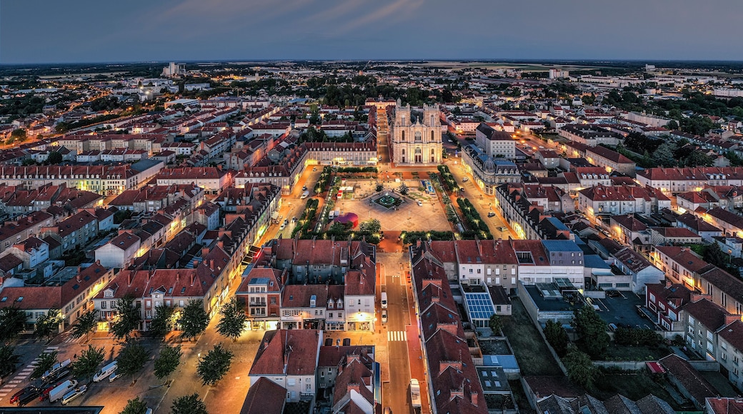 France, Marne, Vitry-le-Francois, Aerial view of illuminated city at dusk with clear line of horizon in background
