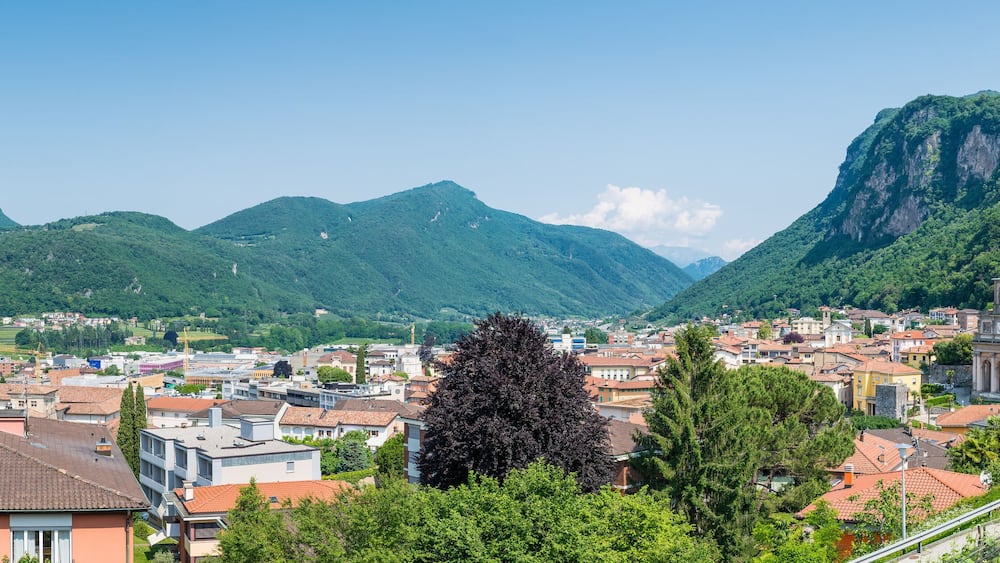 Panoramic aerial view of a Swiss city. Mendrisio with to the right the church of Saints Cosmas and Damian, Switzerland