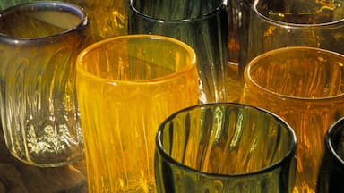 A collection of glassware with varying shapes and colors.
