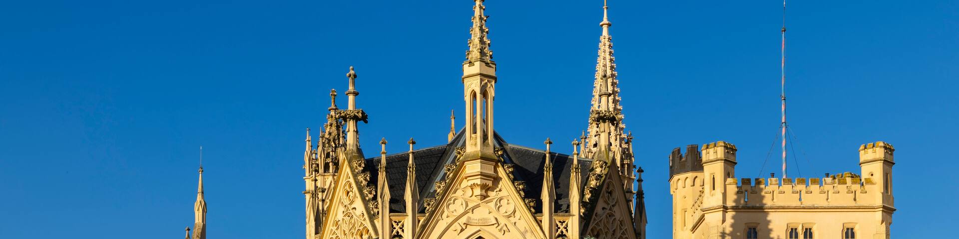 A historic building with ornate Gothic architecture, including pointed arches and intricate stonework.