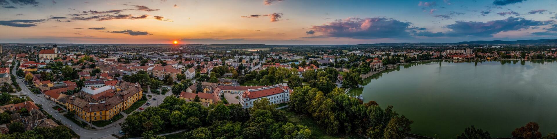 Aerial sunset view over the old lake of Tata with medieval castle surrounded by moat, bastions and walls in Hungary