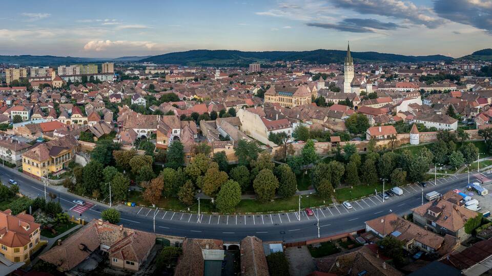 Aerial panorama of medieval Saxon Medias in Transylvania Romania with city walls, church and towers